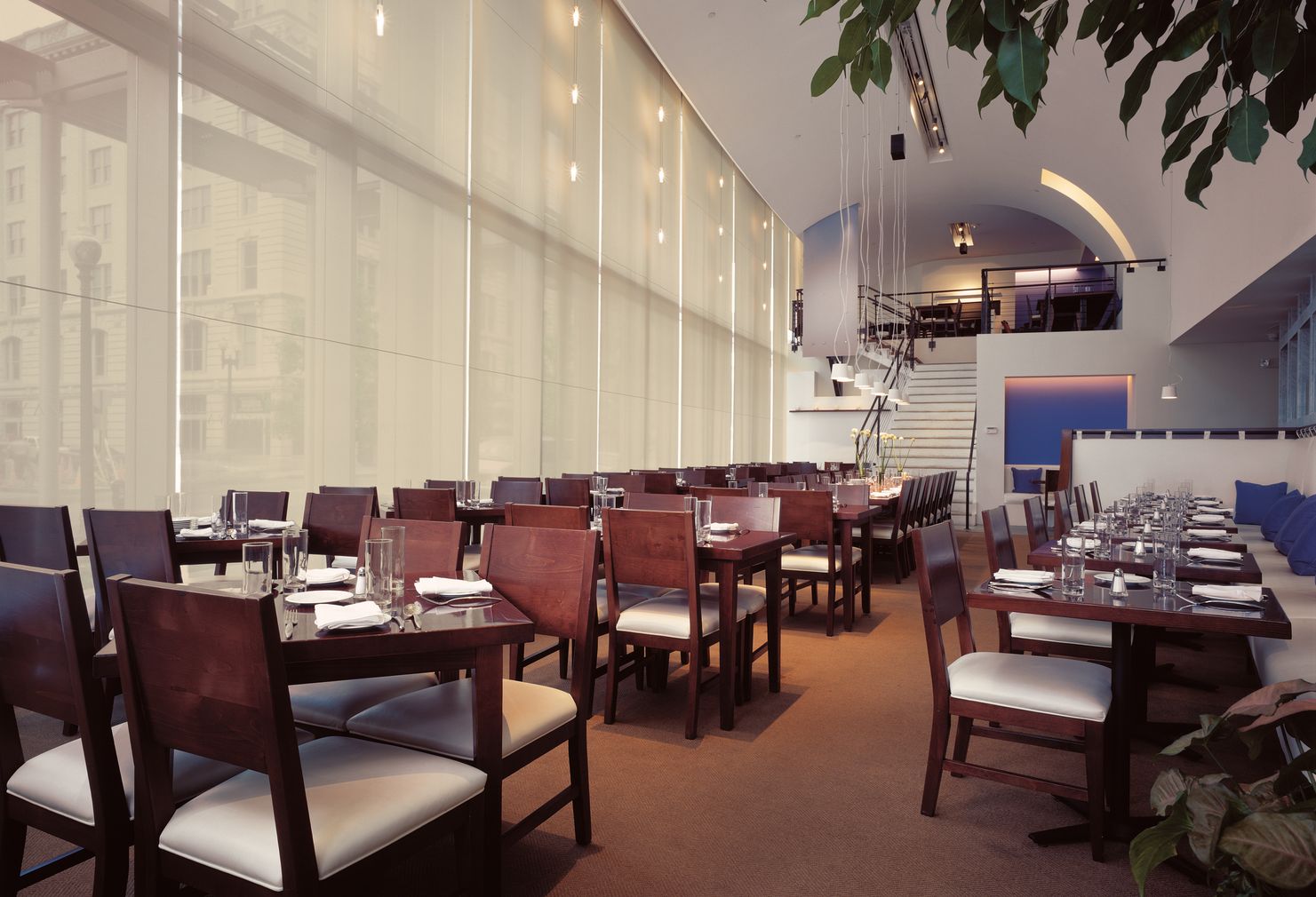 Motorized shades in a dining room